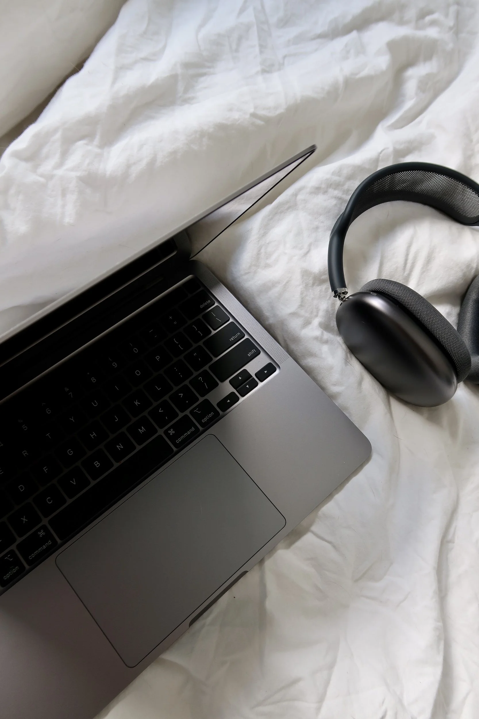 Close view of laptop and headphones