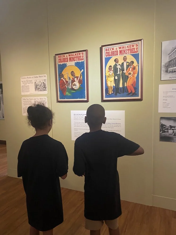 Two children in an art museum or gallery during a field trip organized by Beulah's Bunch.