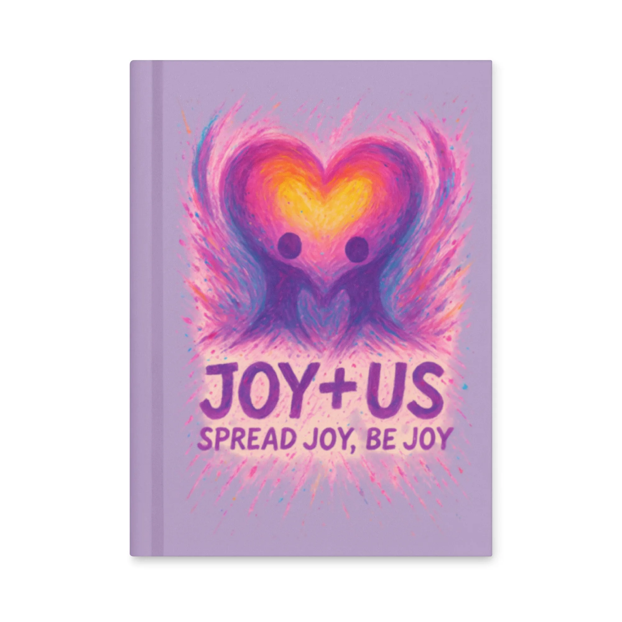 A colorful notebook cover with a heart and two figures holding hands inside the heart, and the text 'JOY + US Spread Joy, Be Joy' on a purple background.