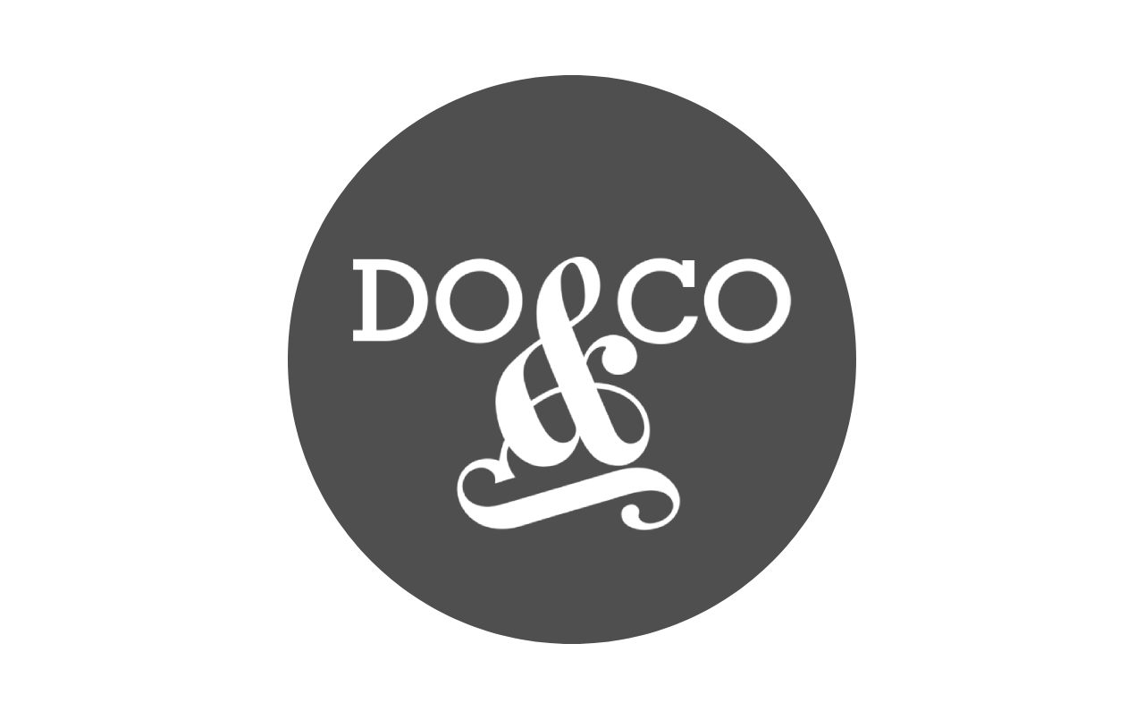 Black background with white text and swirling design that says 'Doco &' in the center.