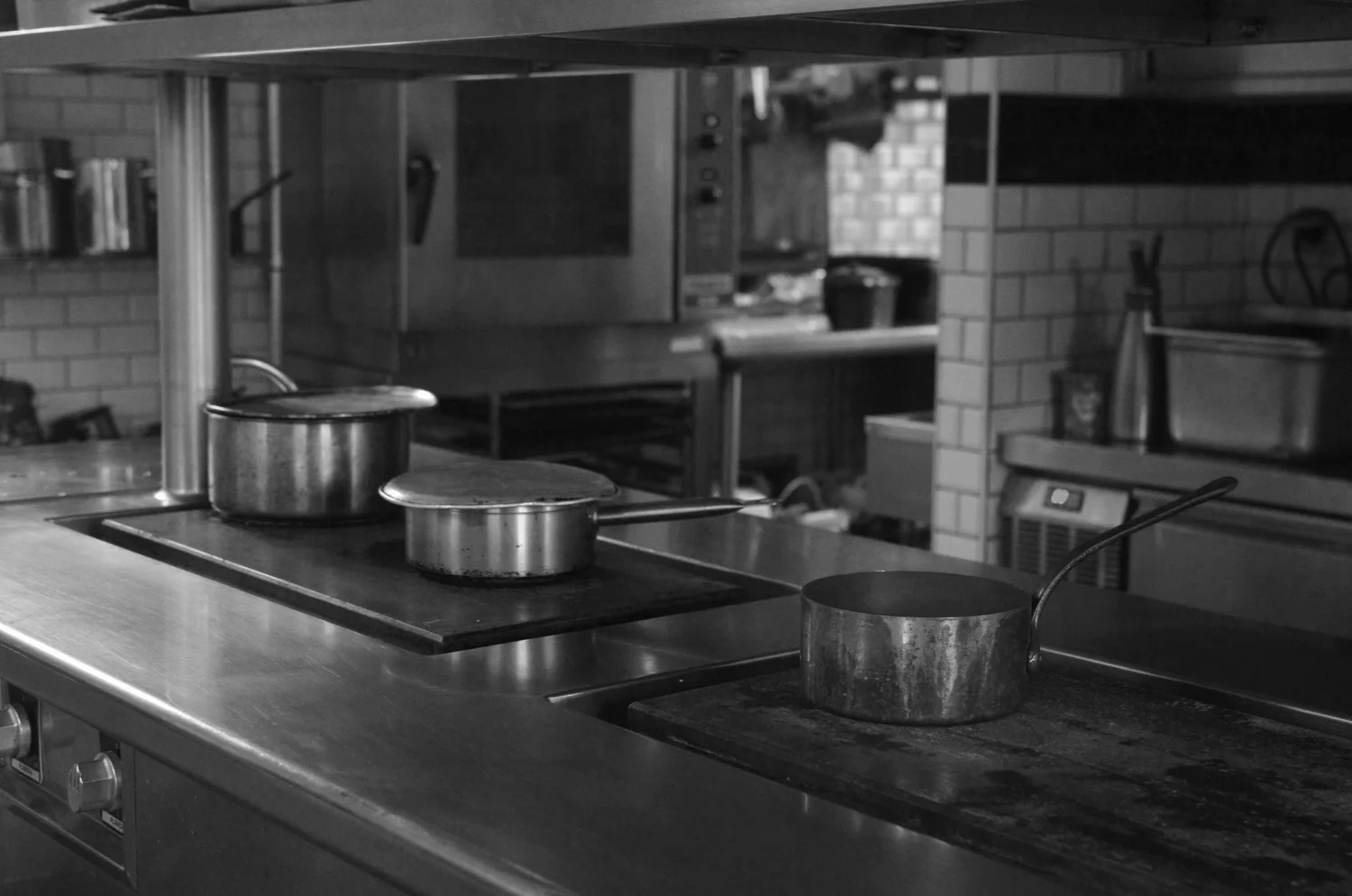 Commercial kitchen with cookware and professional equipment
