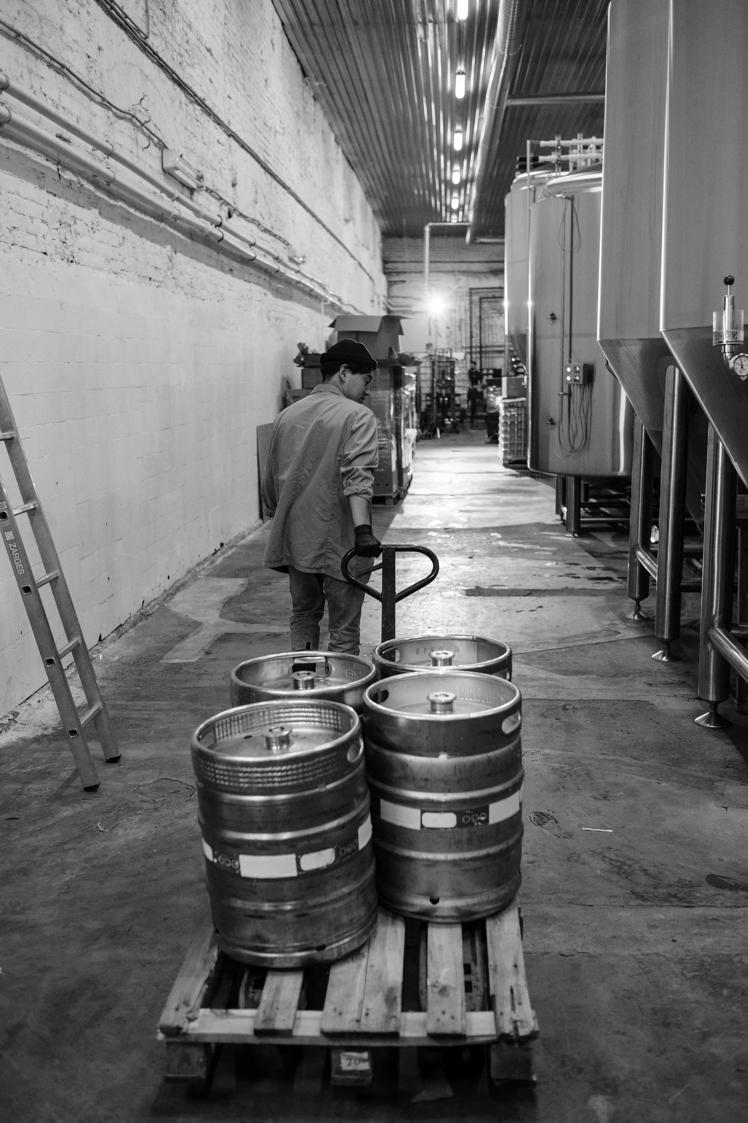 Warehouse worker moving stock through a storage facility