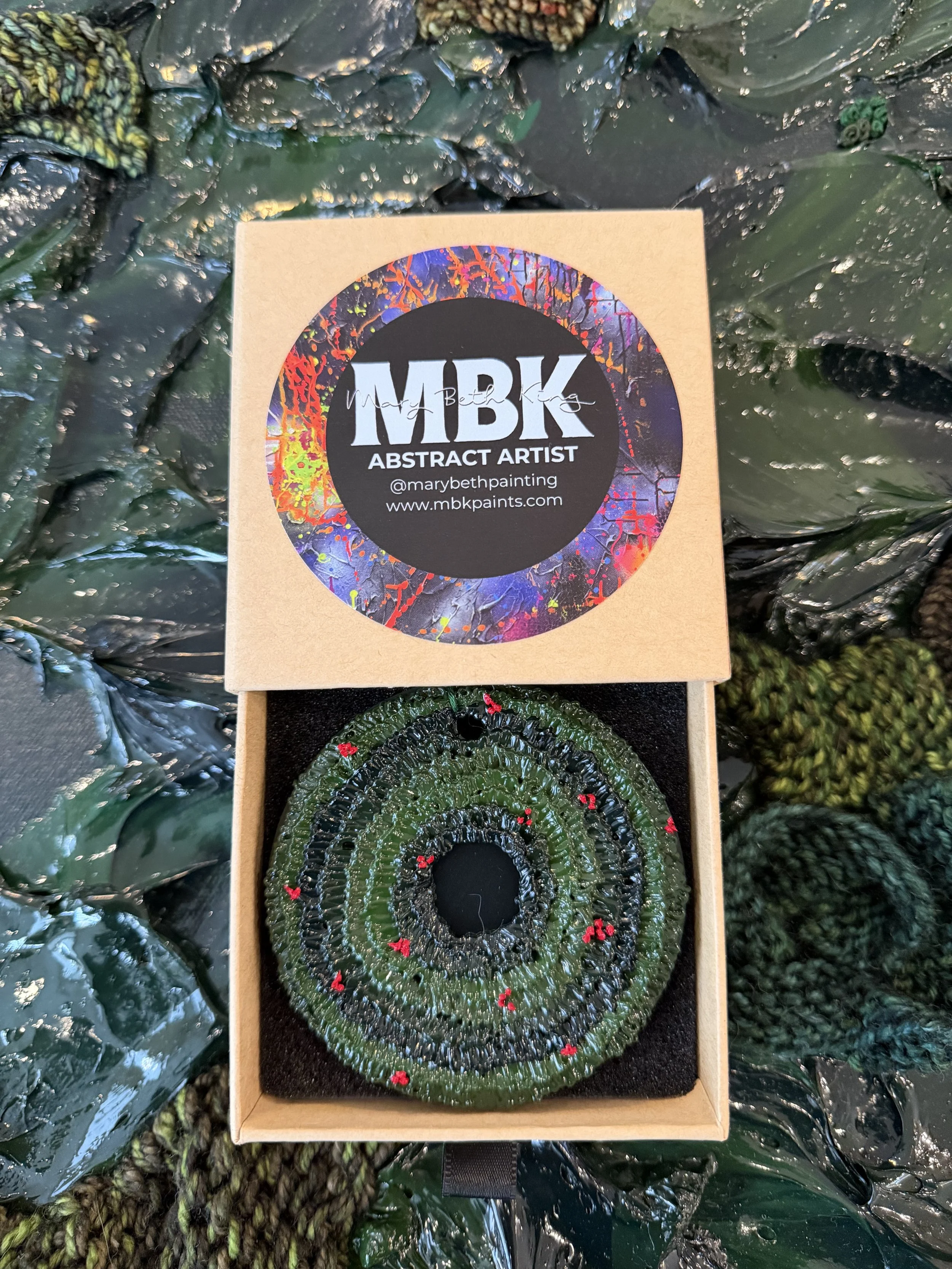 christmas wreath ornament with red berries