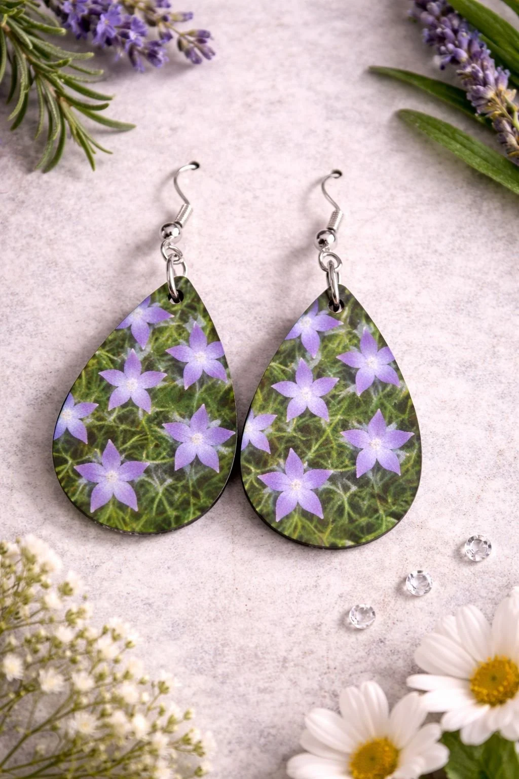 Delicate floral earrings on stone surface (1).jpg