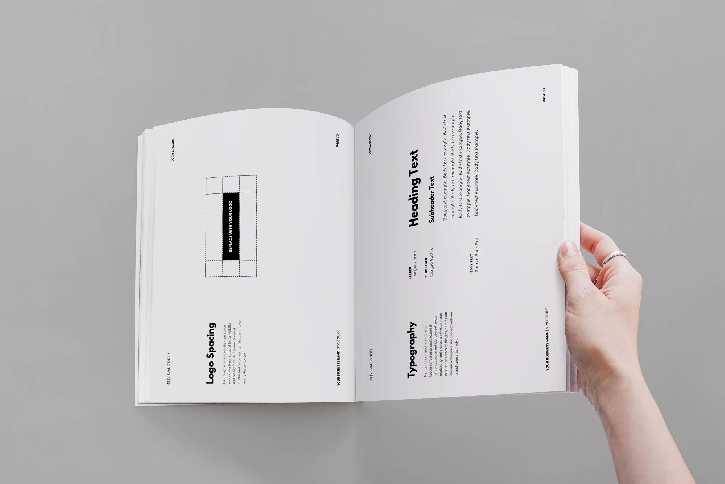 Open magazine with design guidelines, featuring sections on logo spacing, typography, and heading text, with a hand holding the right page.