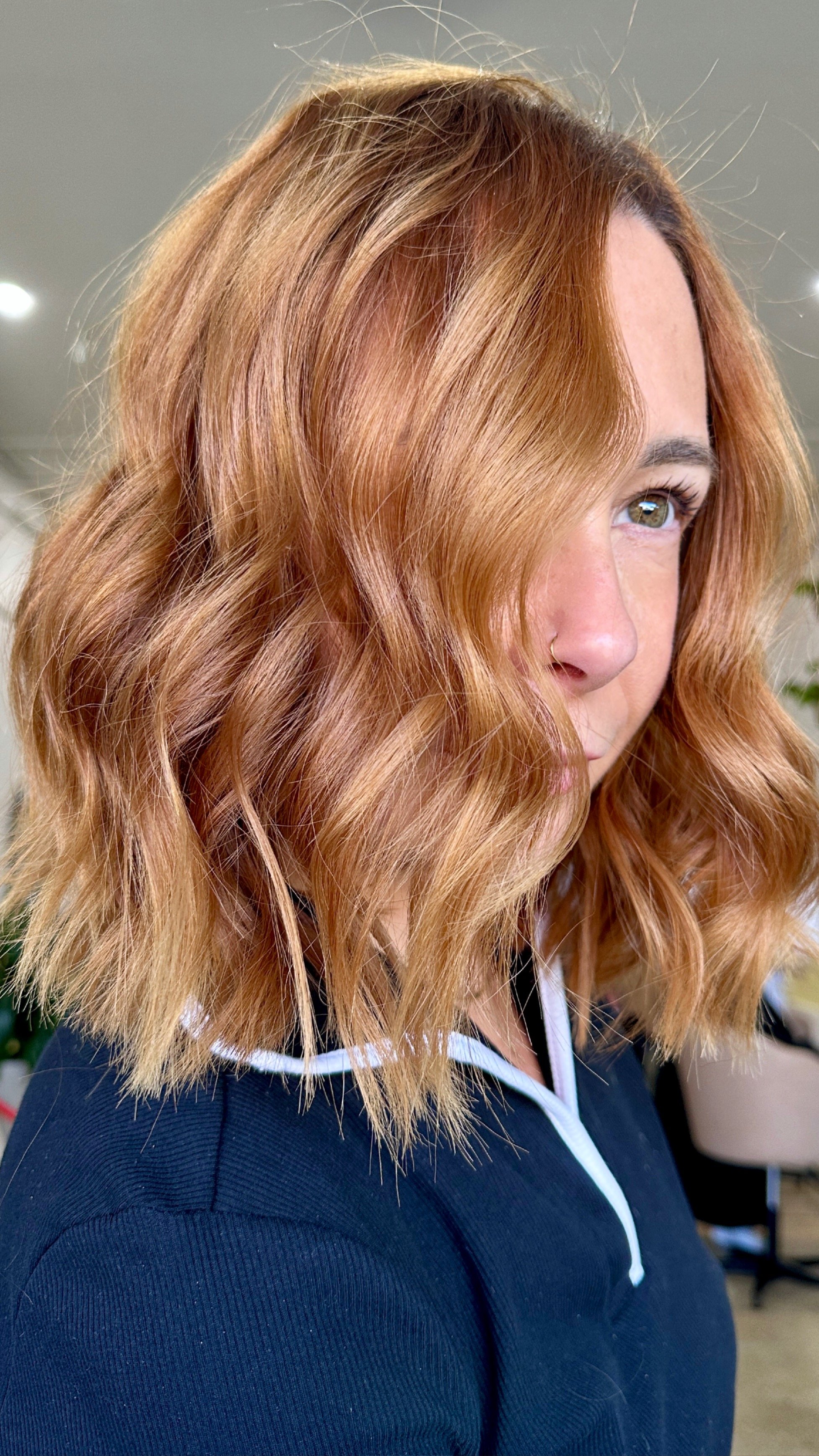 wavy hair styled with straightener. Copper hair.  Brisbane hair salon. Kevin Murphy.