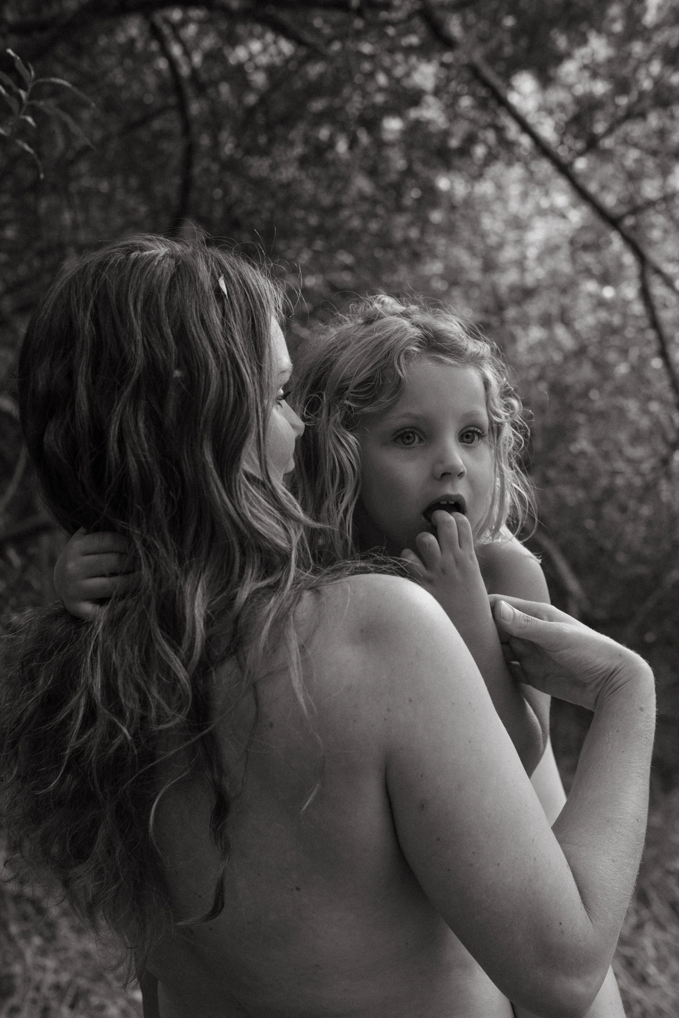 naked mum and little girl in the forest