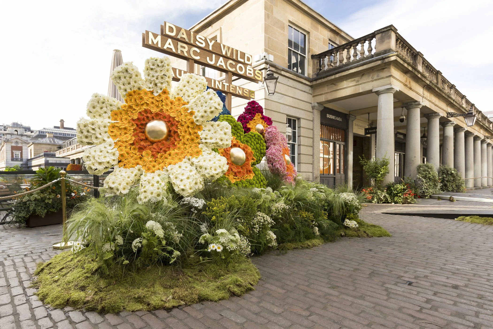 Fresh gerbera and chrysanthemum photo backdrop for Marc Jacobs Daisy activation