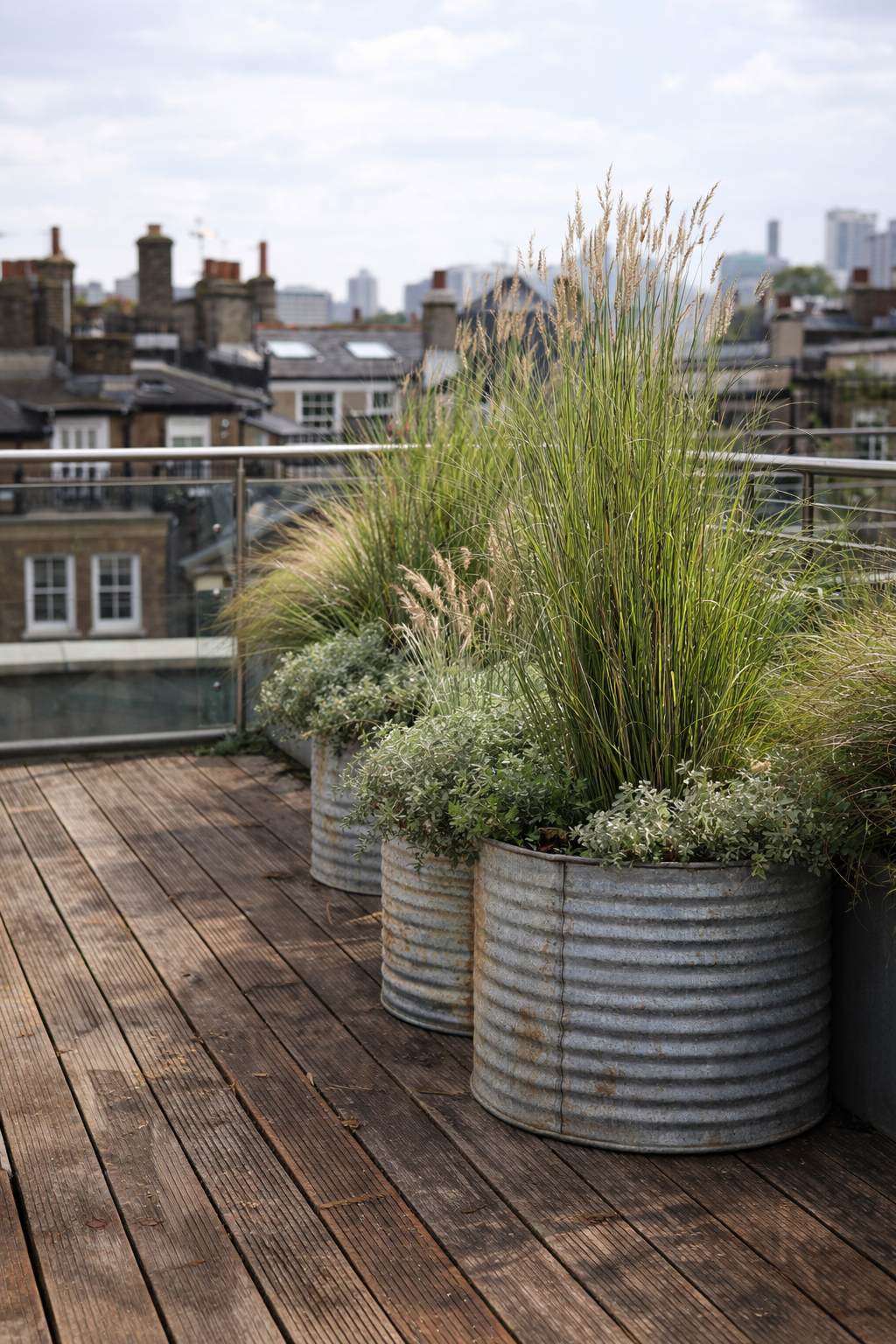 metal planters with planting scheme in exterior setting