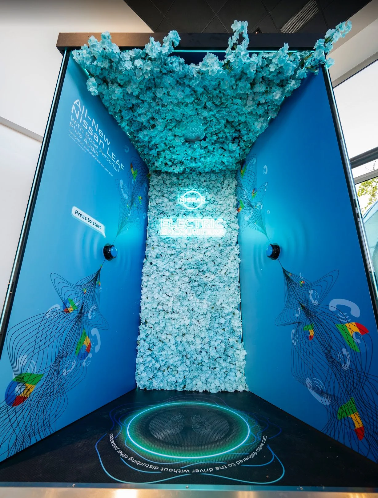 Hand-dyed blue blossom stems for Nissan roadshow touring installation