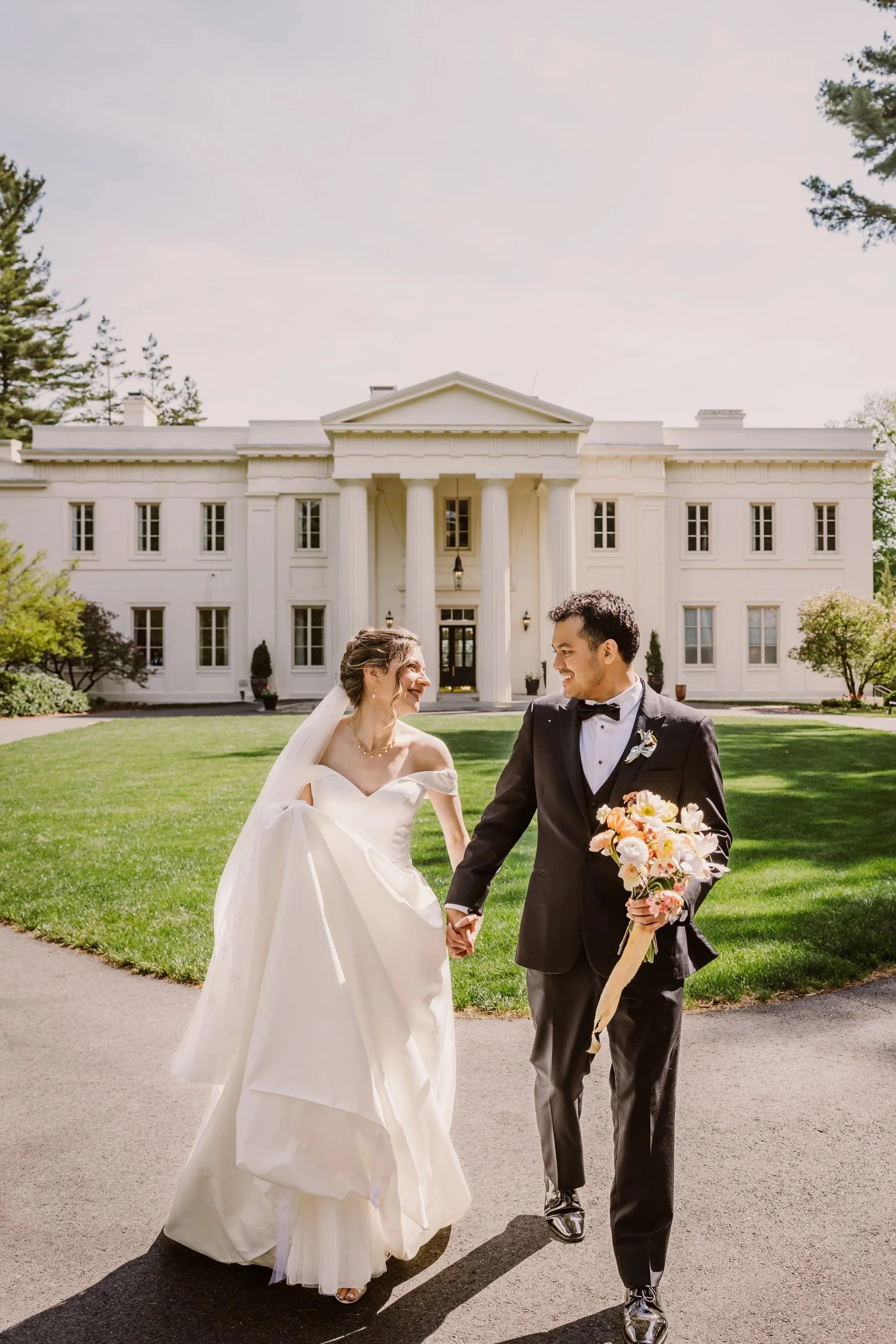 Photo of a happy couple on in front of Wadsworth mansion, a lovely mansion wedding venue in Connecticut