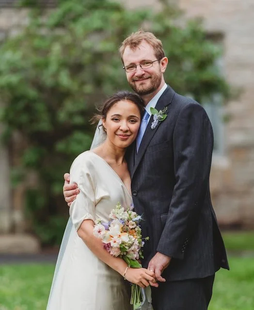 A Happy couple on their wedding day with Rocky Floral flowers