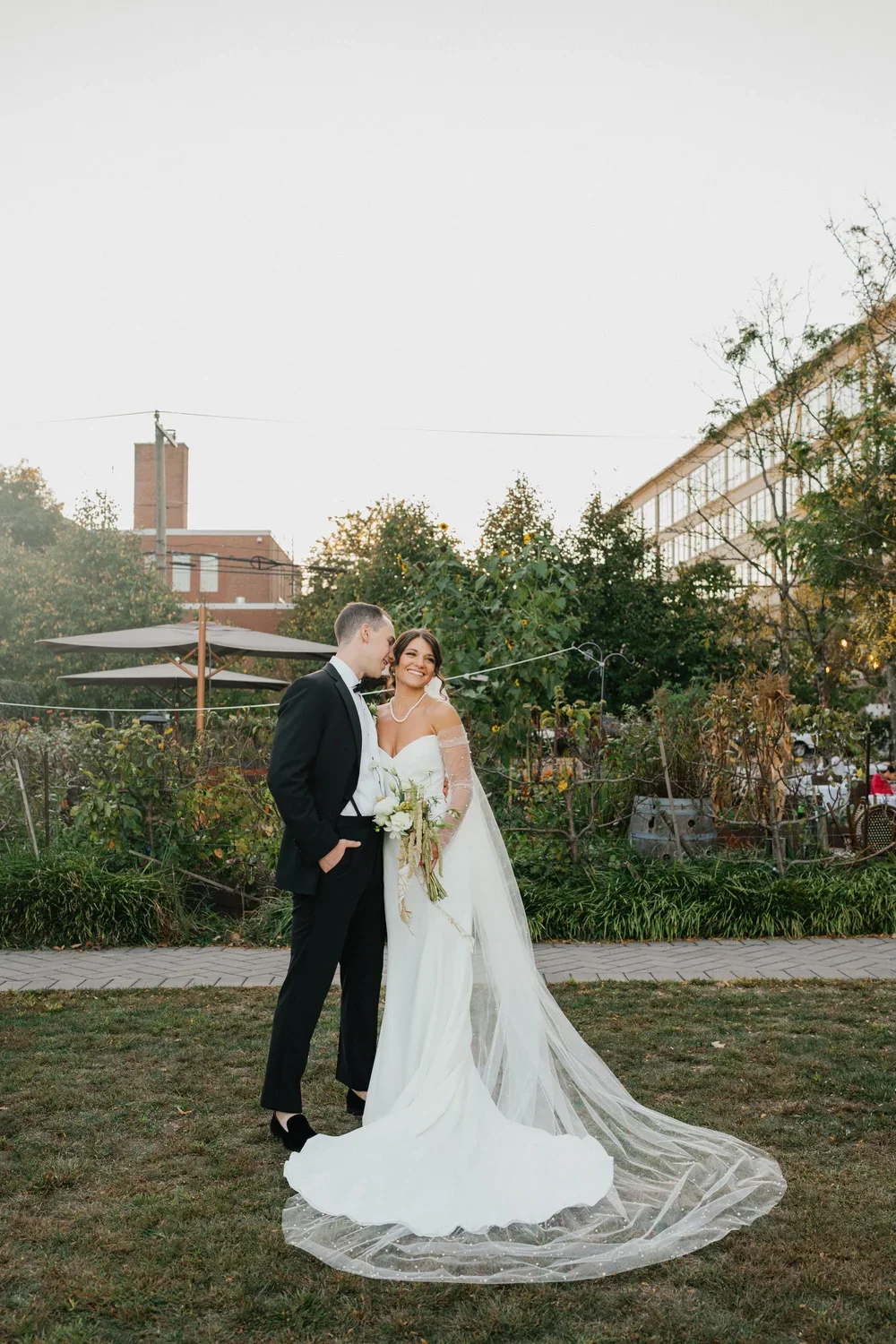 A couple at their fall wedding at Delamar West Hartford, a Hartford Wedding venue with a stunning ballroom and outdoor space.