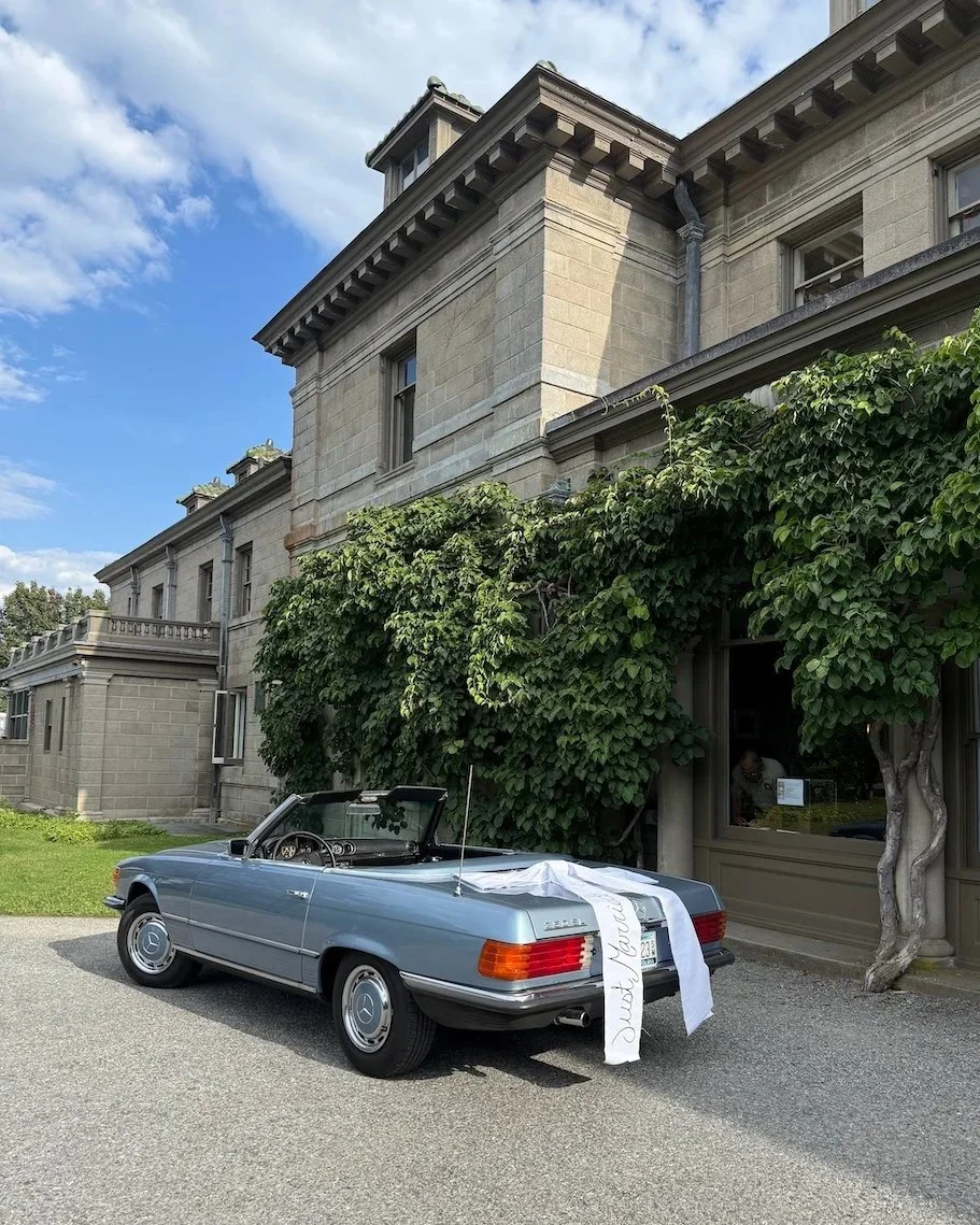 In line with the 2026 wedding flower trends of bows everywhere, this image depicts a getaway car with an oversized bow at an Eolia Mansion wedding.