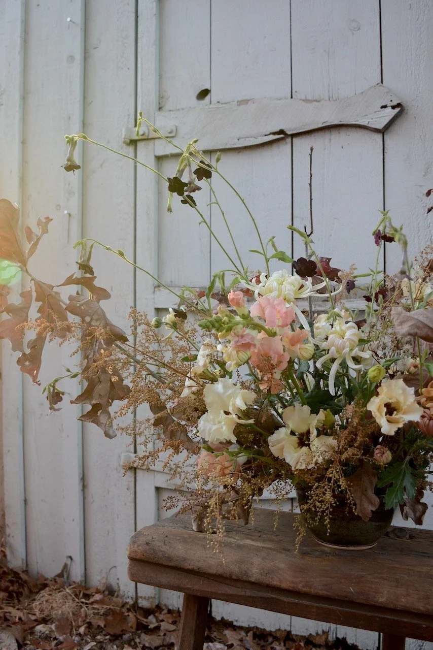 An earthy toned organically styled bar flower statement piece