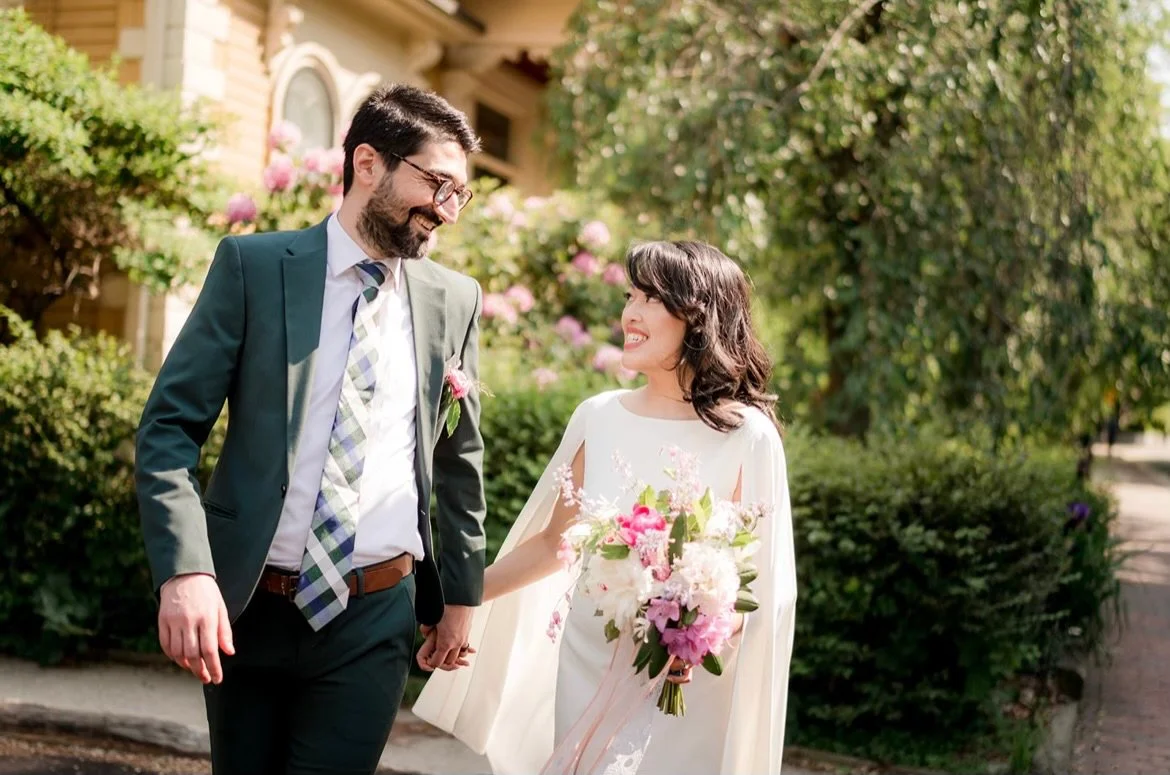 A bridal bouquet of pink, purple, white, and yellow flowers, designed by Rocky Floral, a Connecticut wedding florist with artistic and bold designs and fantastic reviews.