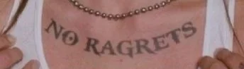 no ragrets tattoo on chest demonstrating irony of tatu regret so needing laser removal