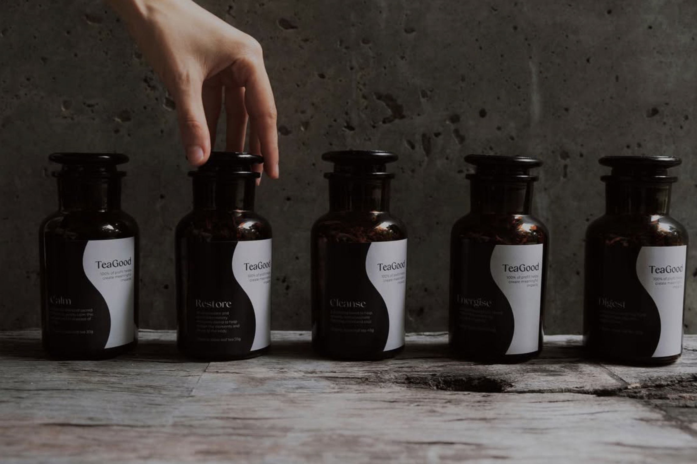 teagood loose leaf tea alchemy in amber jars showing different blends of their herbal wisdom - calm restore cleanse energise digest