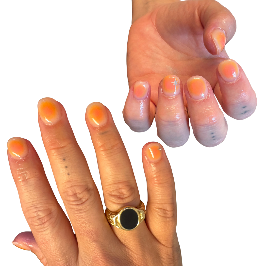 angel aura gel nails pink and orange theme with mini gold star sparkle
