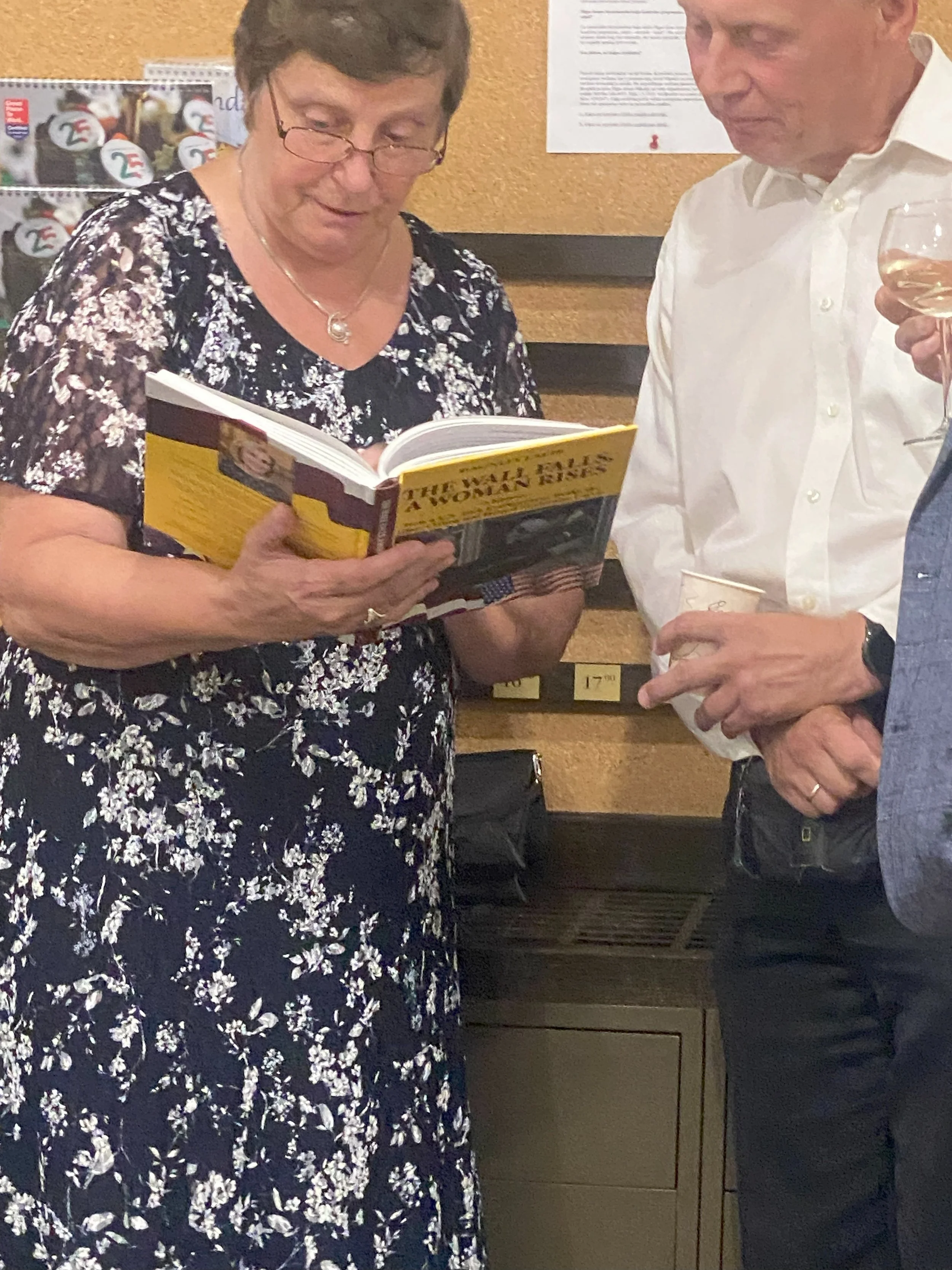 Ilze Freivalde and Aigars Gertners reviewing pictures of themselves in The Wall Falls. August 7, 2025