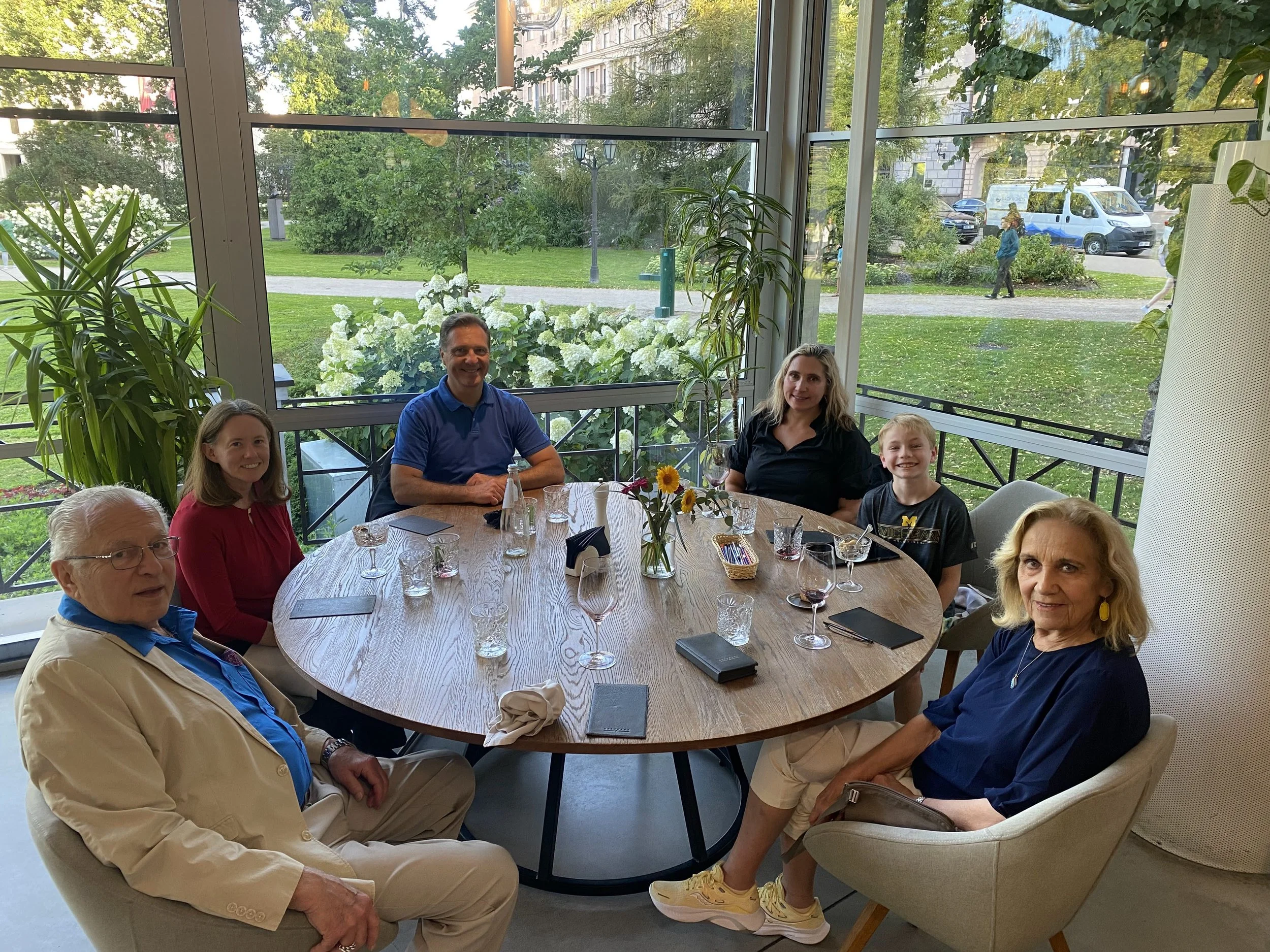 Our son Ed and his wife Andrea join us for dinner. From left, Andris, Andrea, Ed, Larisa, little Andris and Daggie. August 6, 2025