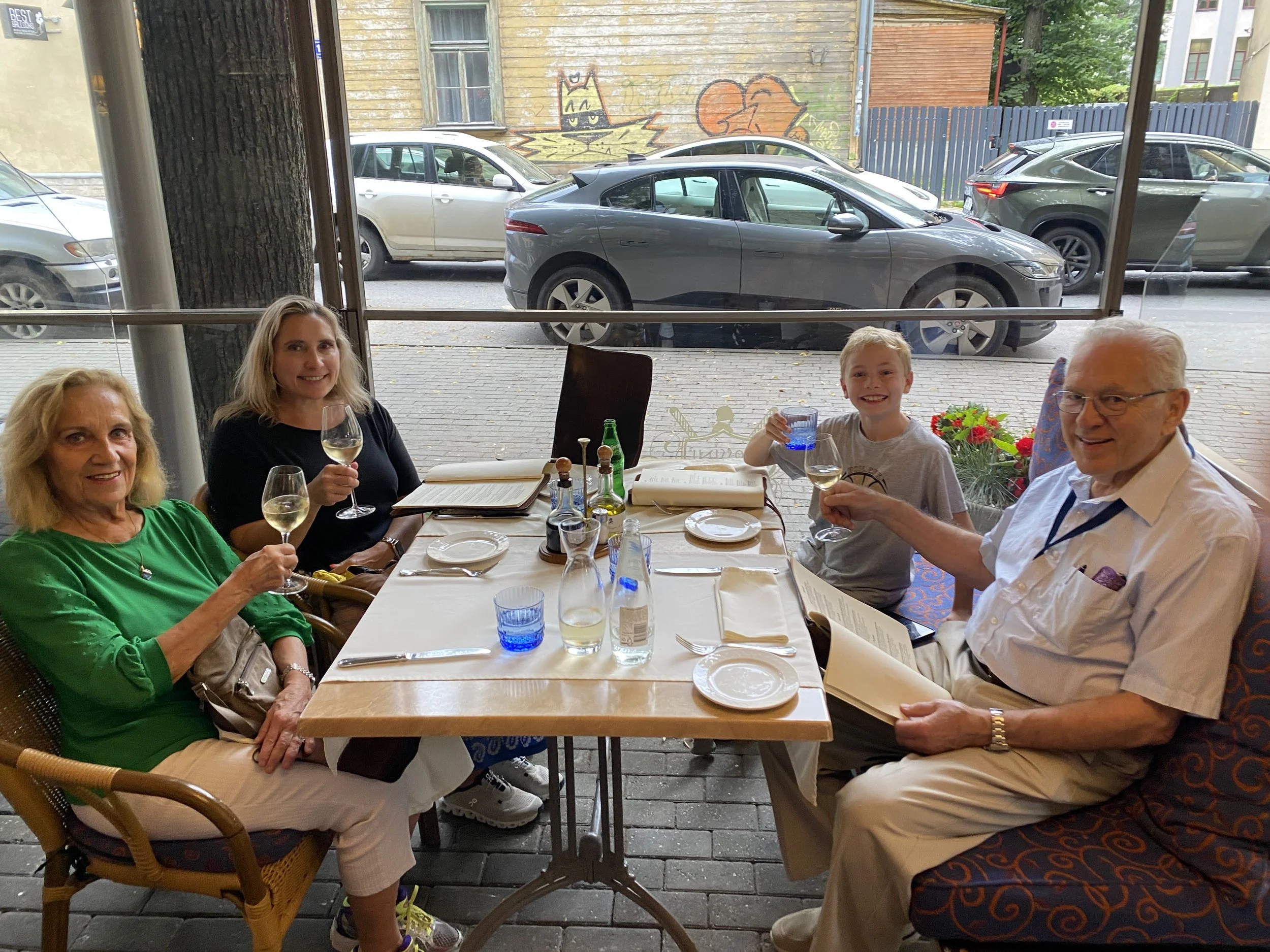 Daggie, Larisa, little Andris, and Andris at Rossini’s during the family trip to Latvia (July 19 to August 9, 2025). July 23, 2025