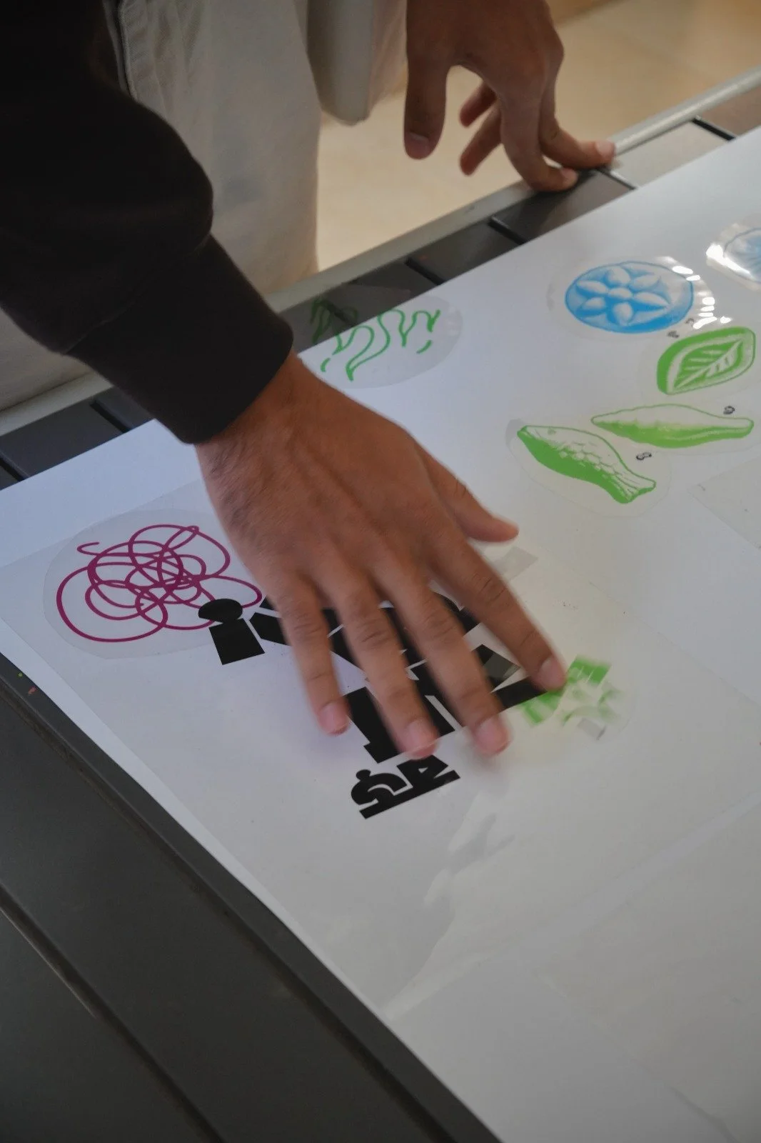 People using the typographic and illustrative elements to make their own screen printing designs