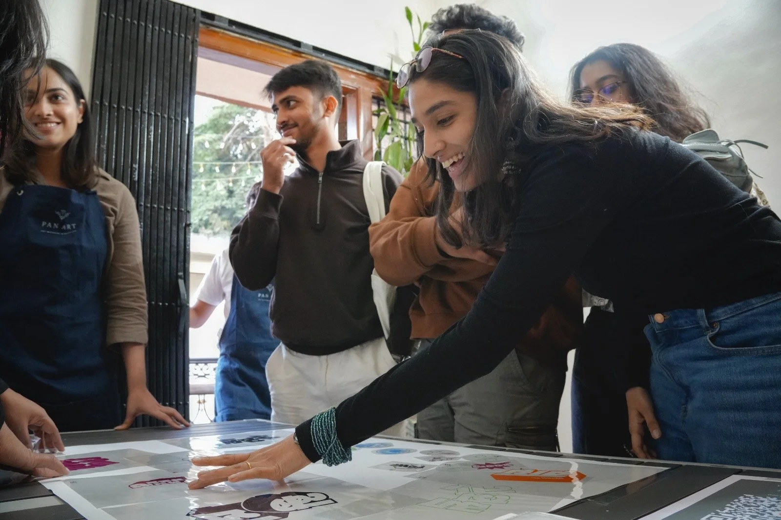 People using the typographic and illustrative elements to make their own screen printing designs