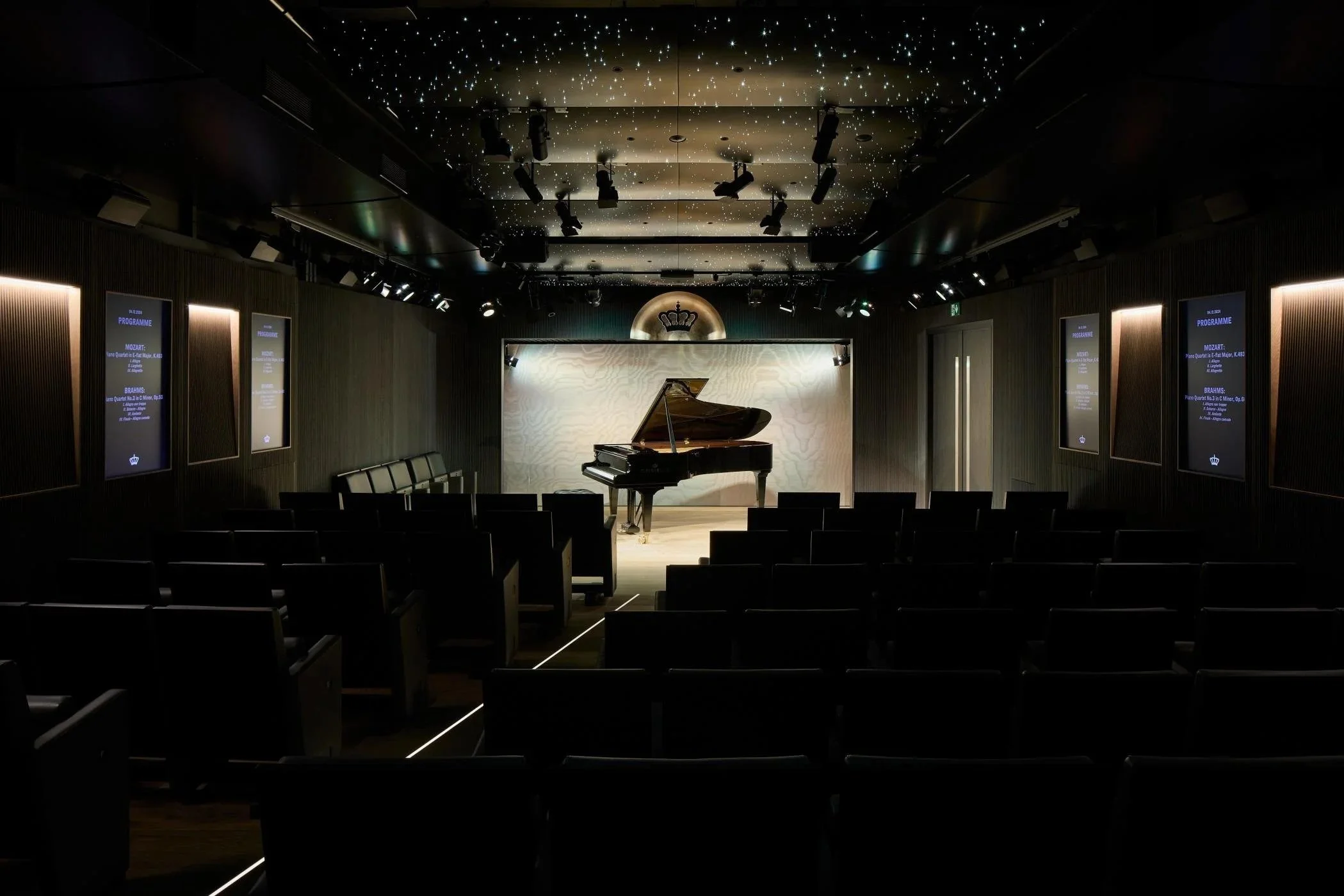 Elegant modern recital hall interior design by a professional interior design studio, Door Nineteen featuring refined architectural details, acoustic design, premium materials and bespoke furniture and lighting