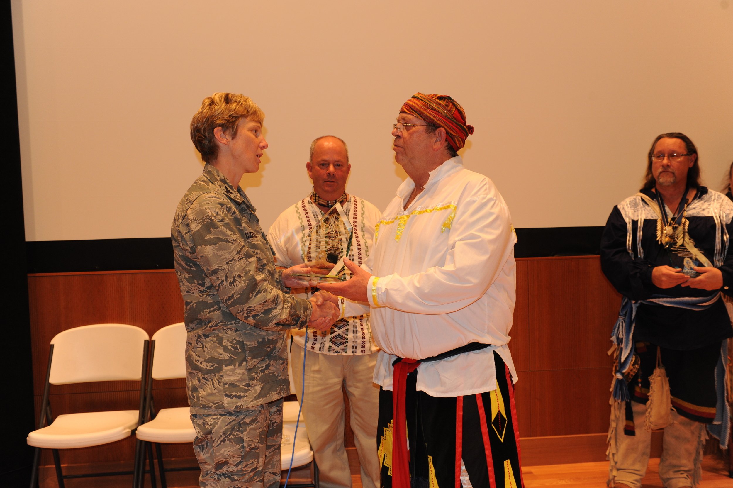 The Indiana Miami receiving a Recognition award from the Base Commander.
