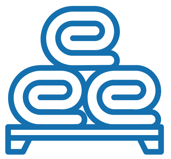 Stacked towels on a cloth-covered table