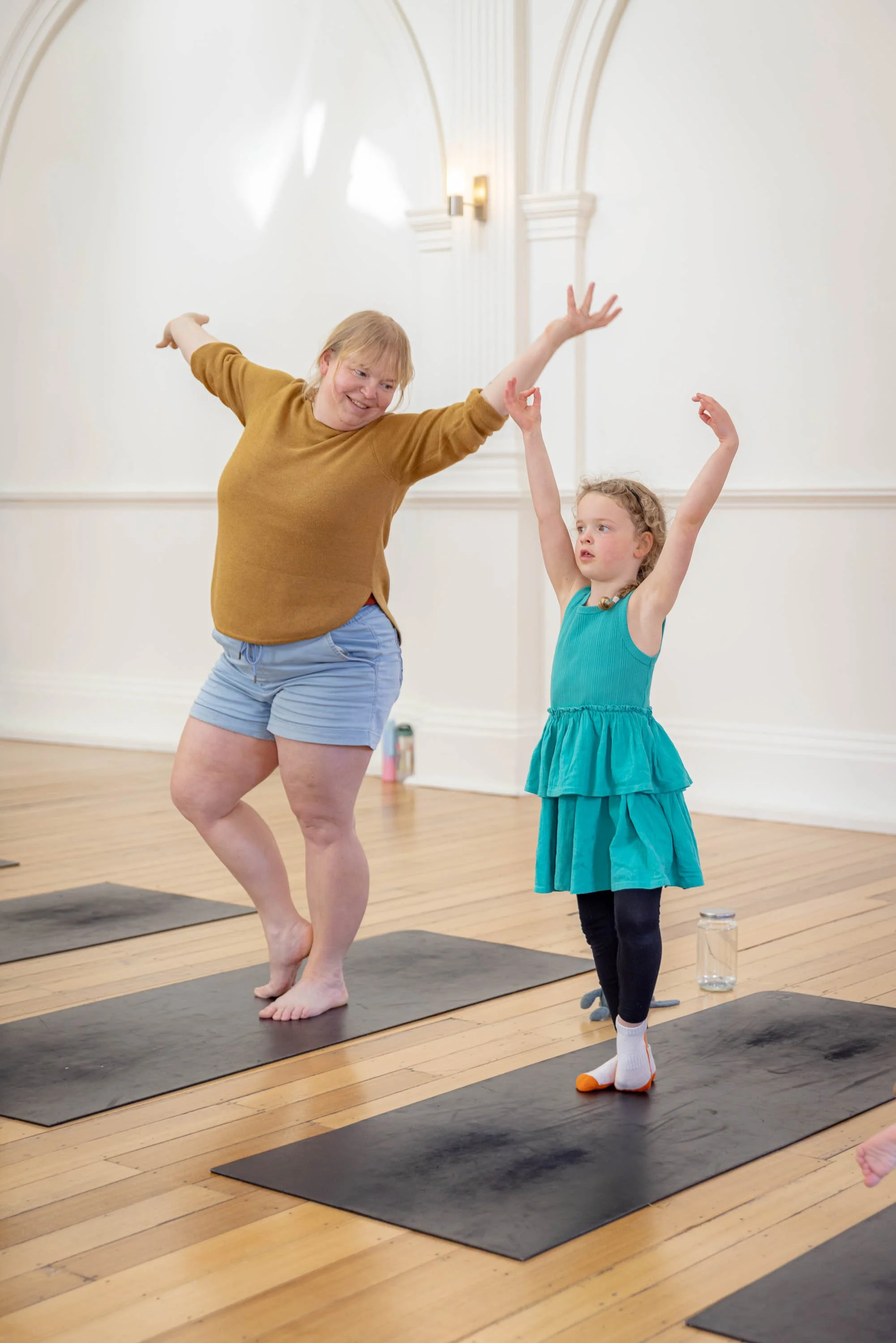 Mother and daughter doing yoga