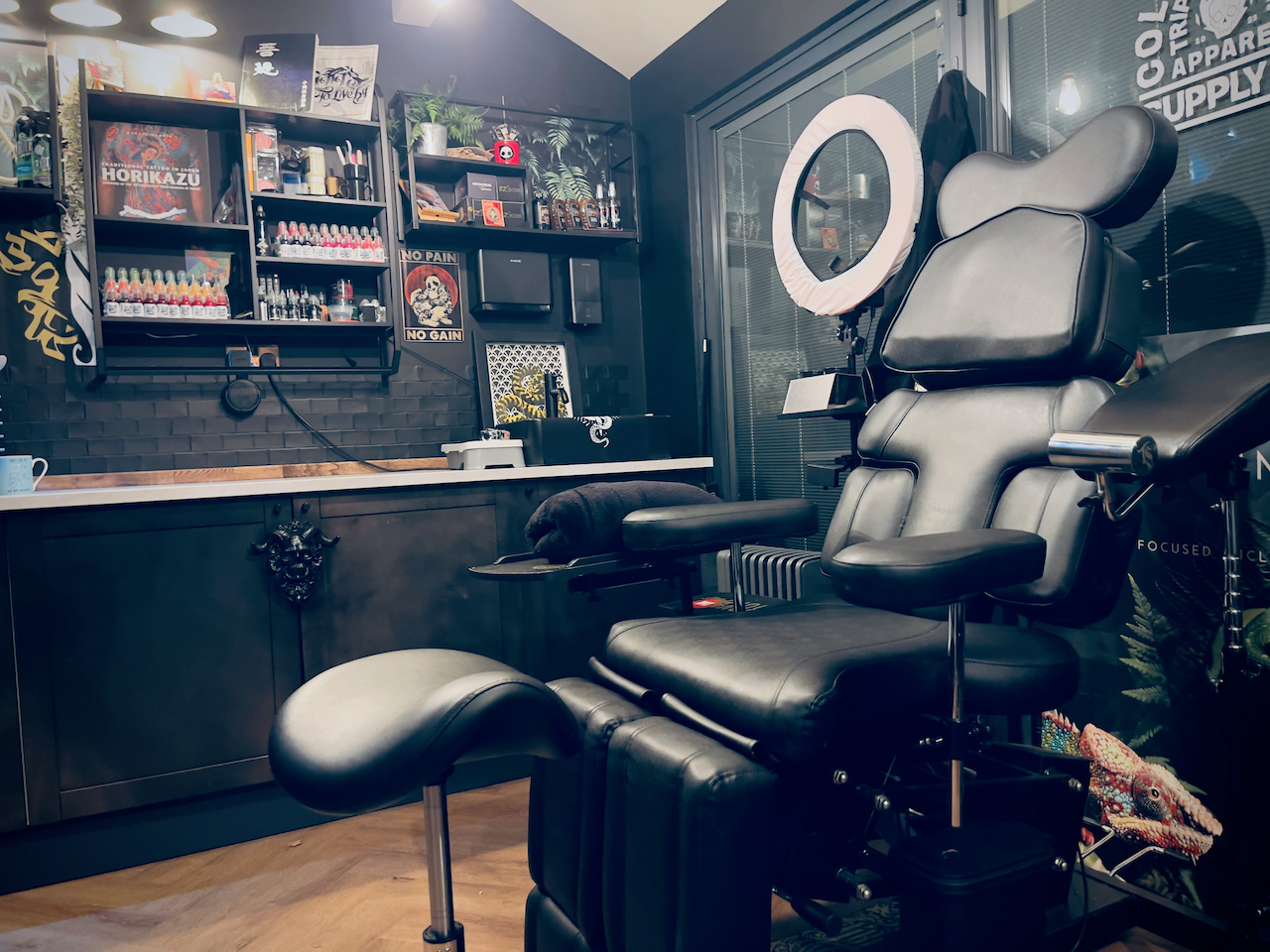 Tattoo chair and workstation inside Kuroko Ink studio