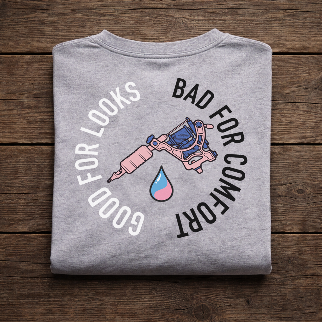 Folded grey Kuroko Ink T-shirt with tattoo machine back print