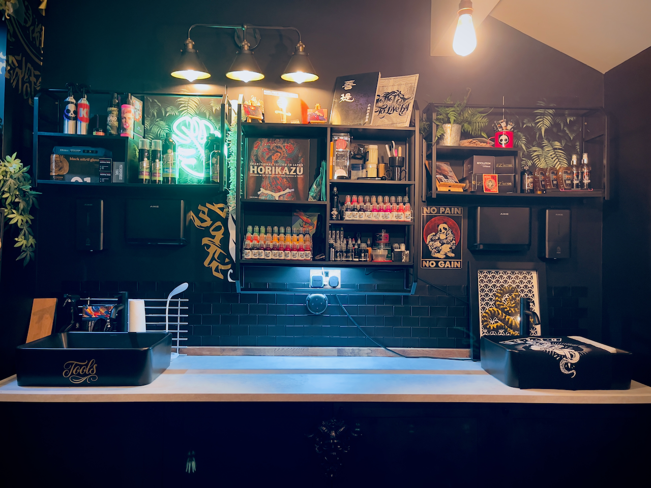 Sink area and display shelving inside Kuroko Ink studio