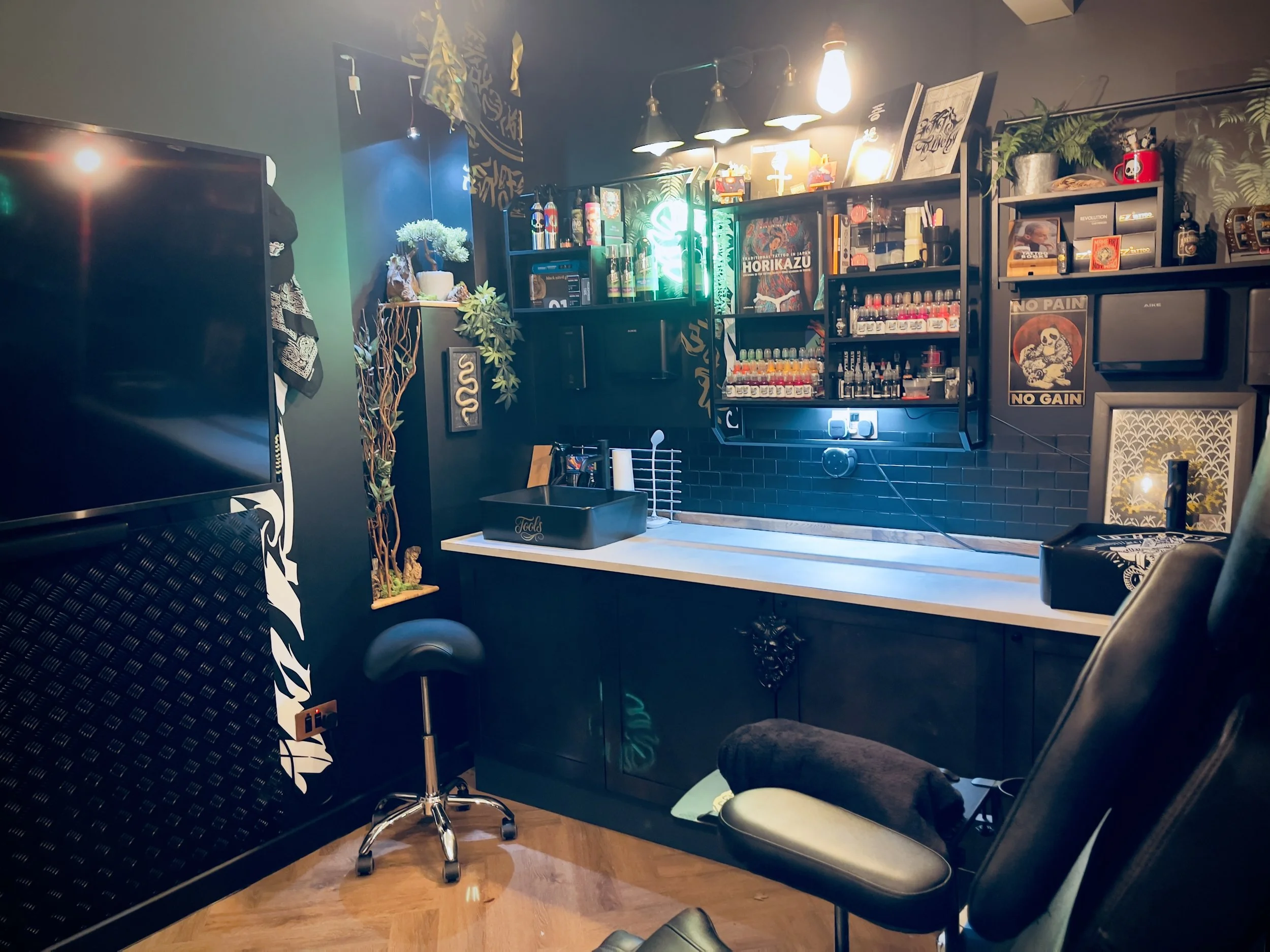 Tattoo workstation and sink area inside Kuroko Ink studio