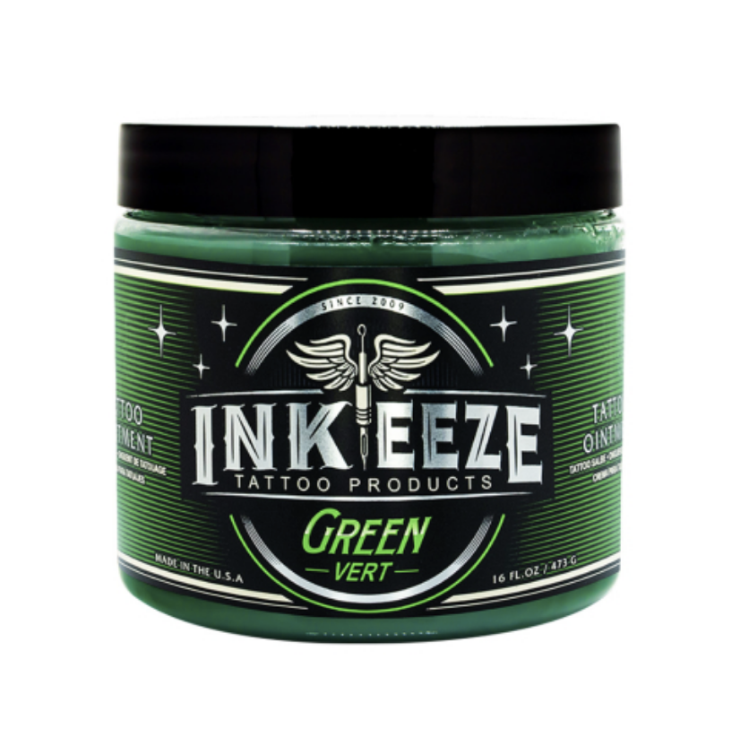 A jar of INK EZE green tattoo ointment with a black lid, green and black label design, and text indicating it is made in the USA, 16 oz, and meant for tattoo healing.