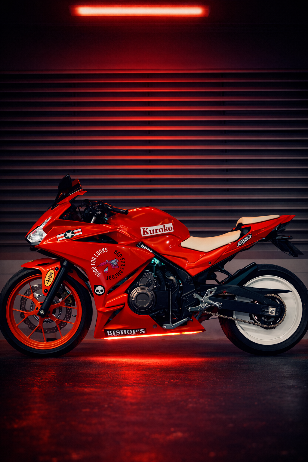 Red motorcycle with racing decals and graphics, parked indoors against a dark background with horizontal lines and red lighting.