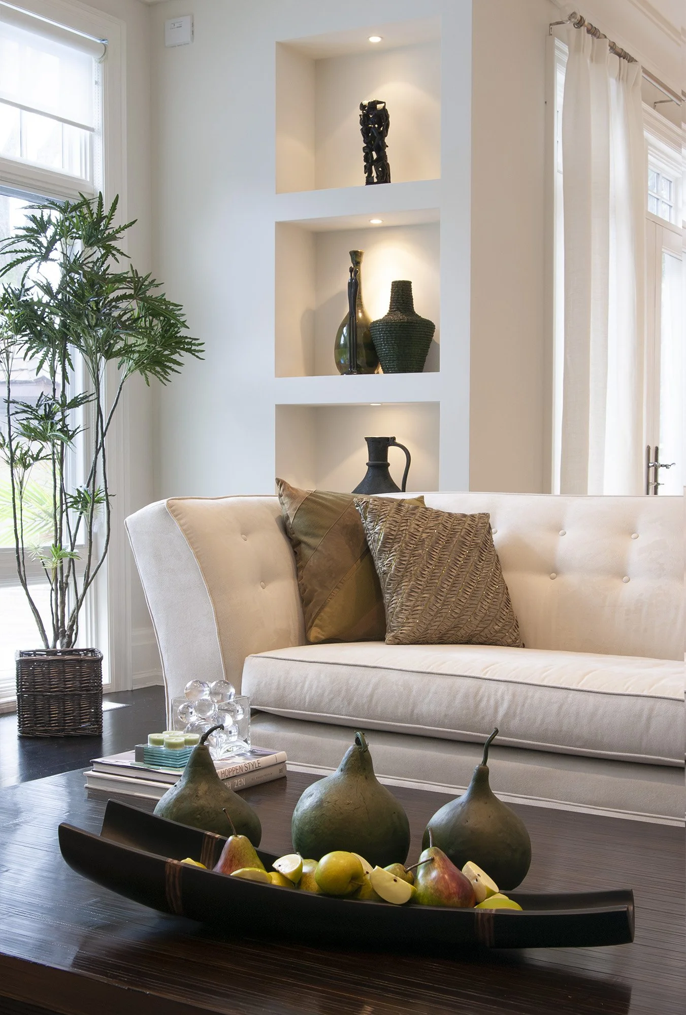 Living room detail with built in lit shelves