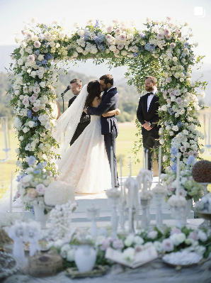 full flower chuppah with elegant soffreh