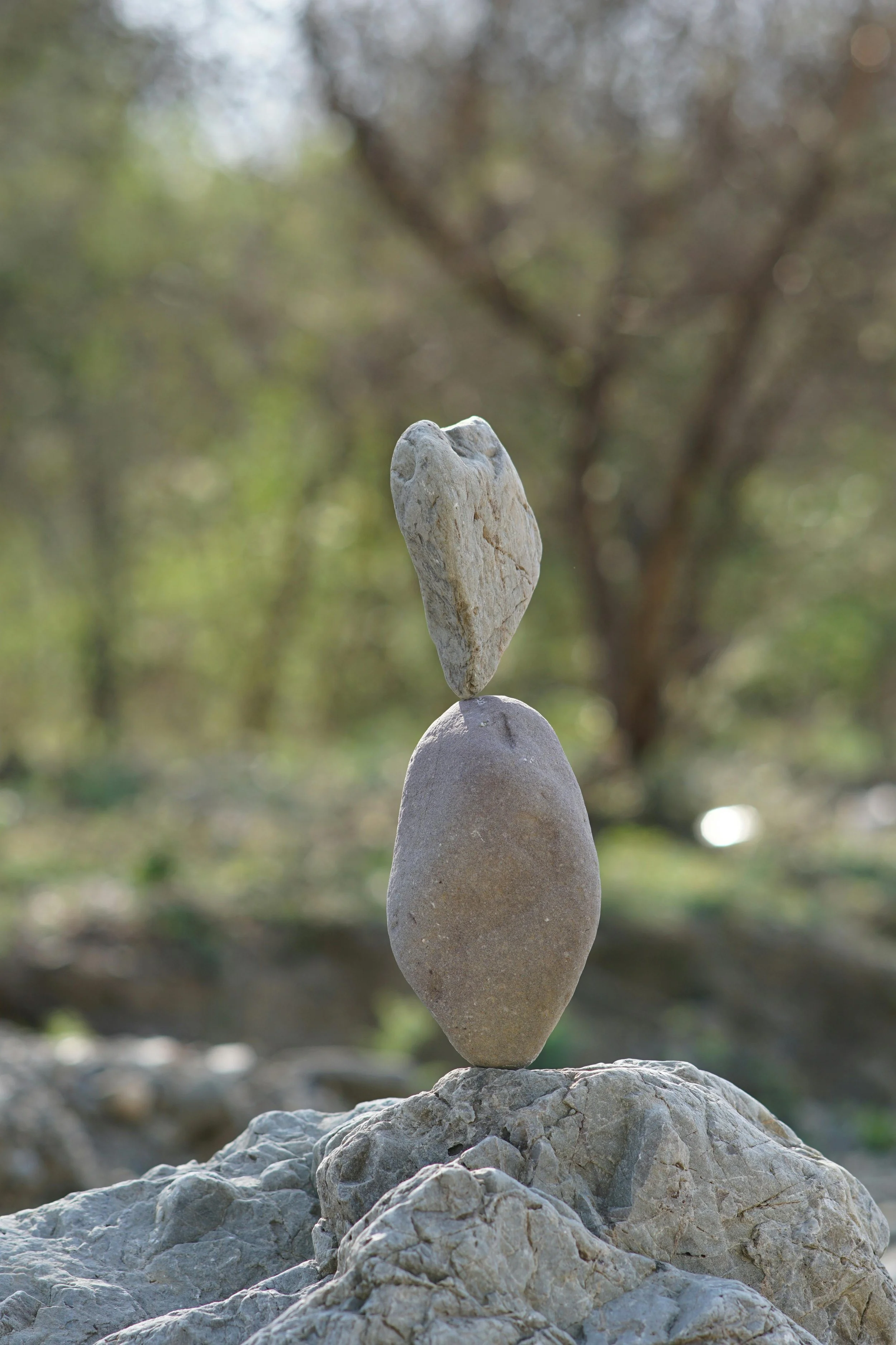 a rock balancing on a rock
