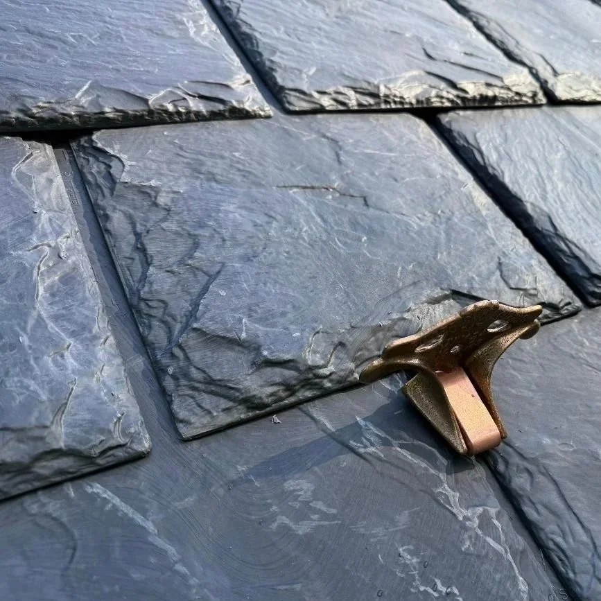 Brava Slate Tile Roof installation by Sugarsbridge Contractors featuring custom copper snow retention breakers.