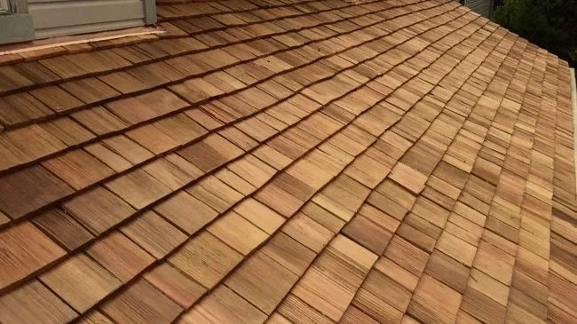 Close-up image of a roof with cedar shingles.