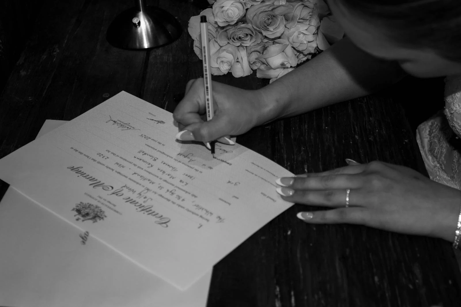 bride signing the marriage certificate