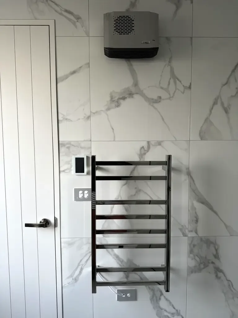 Heated towel rail and ventilation installation in new build bathroom by Tweed Electrical, Christchurch