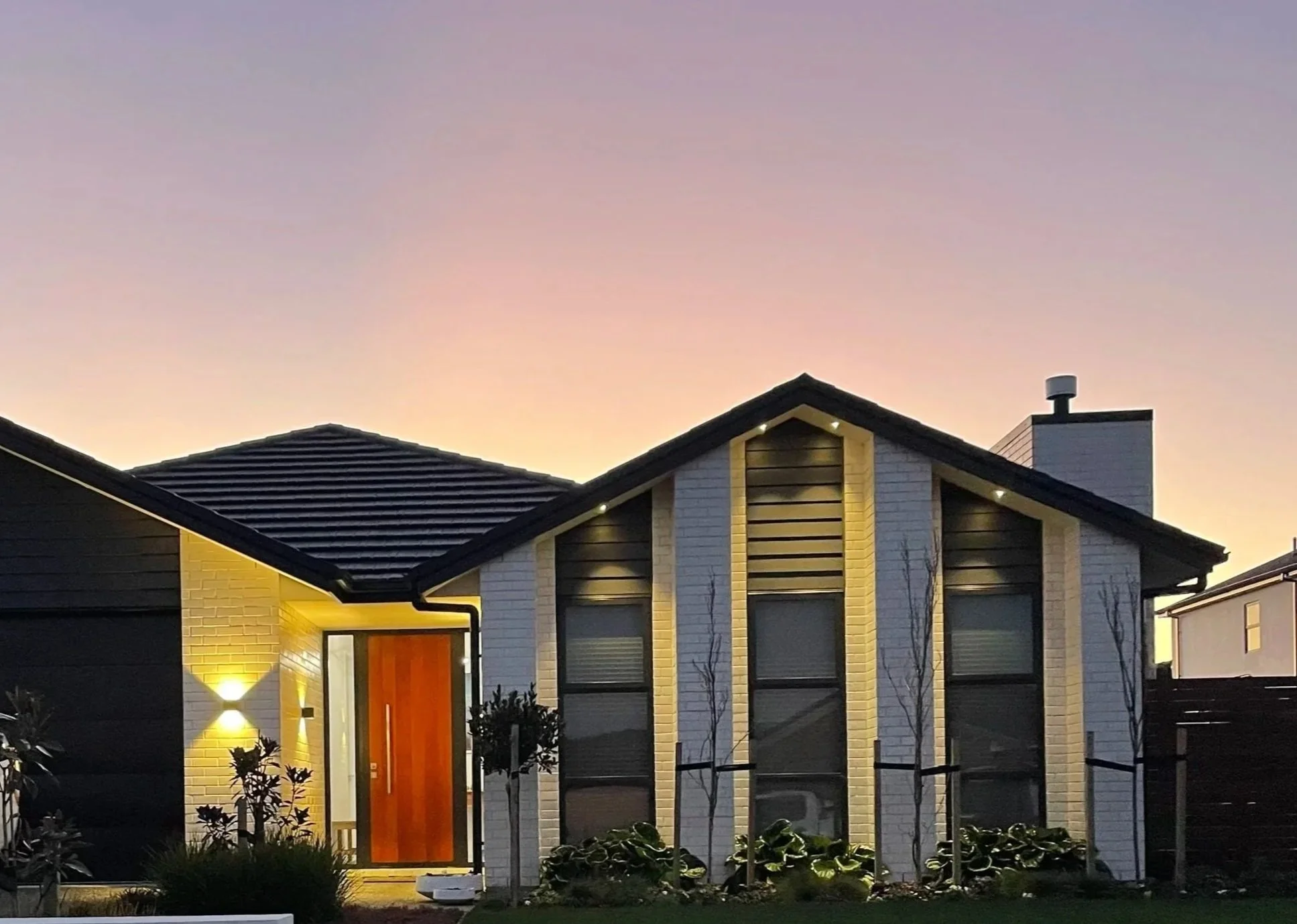 Exterior of house with sunset yellow ambient lighting