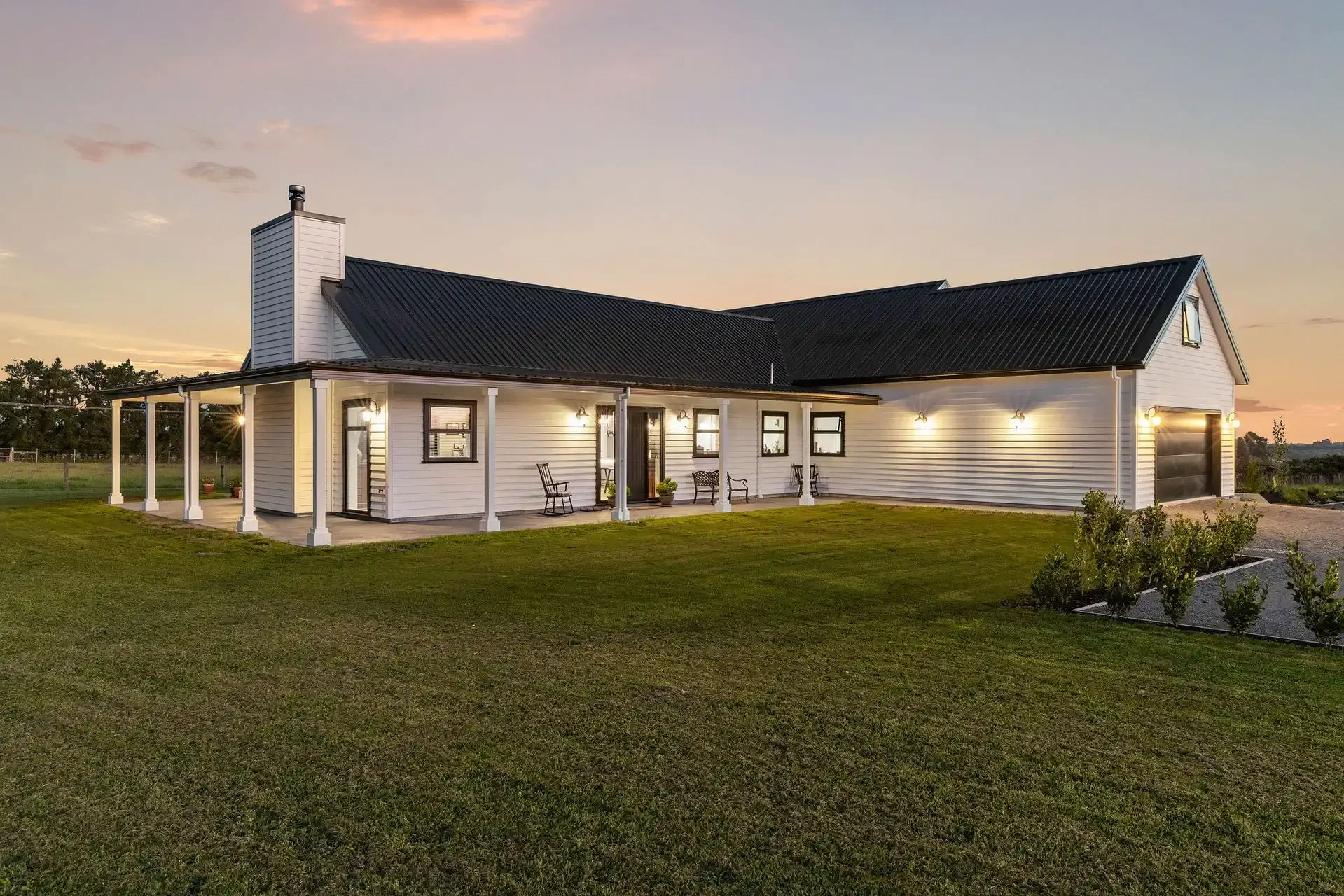 Large barn like house, showing goose neck lights