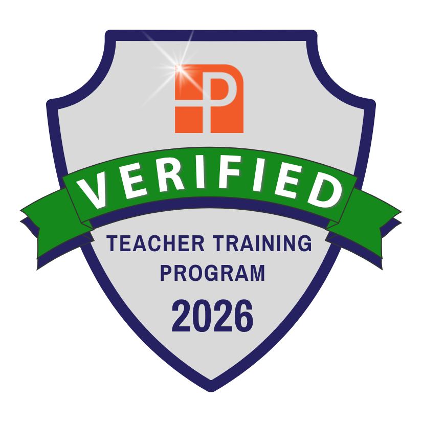 A badge with a shield shape that reads "Verified Teacher Training Program 2026," with a green banner across the shield that says "Verified," a red symbol at the top, and a starburst light effect.