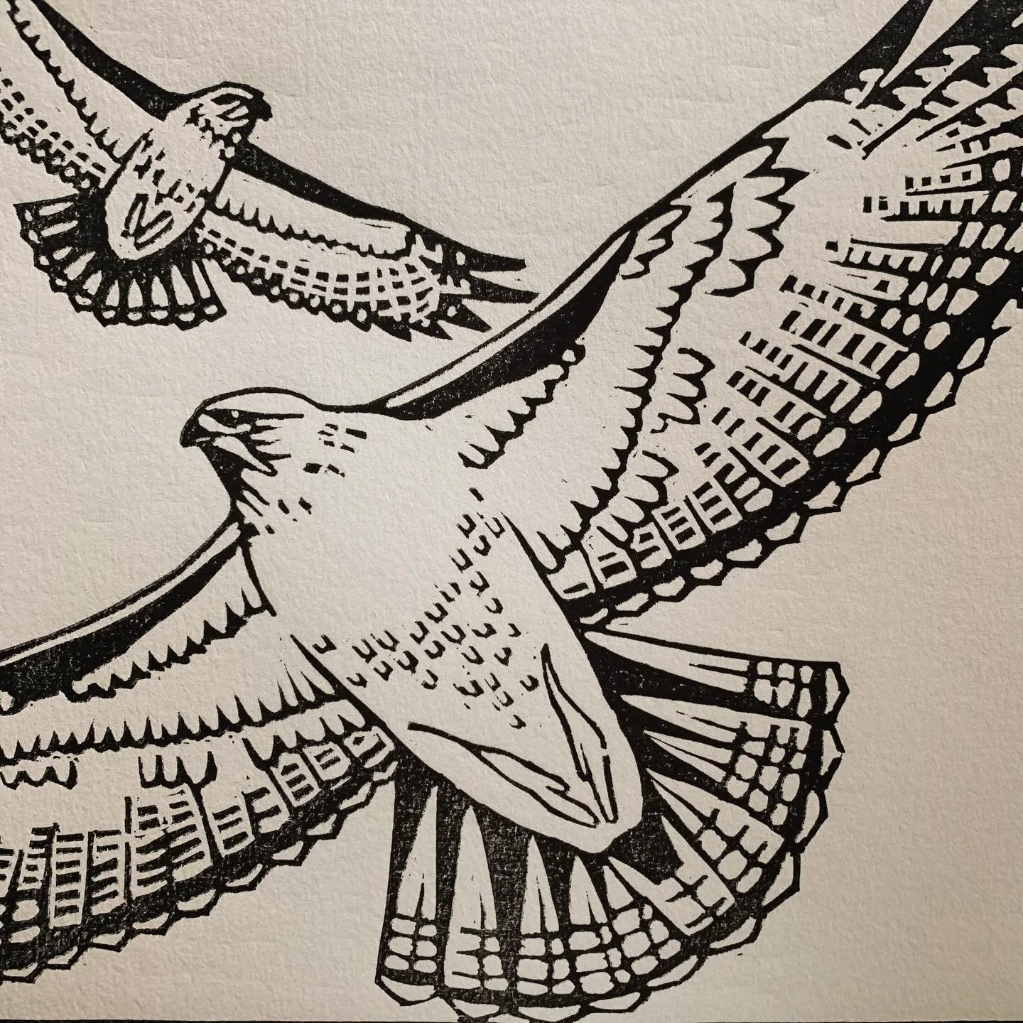 Key block outline of soaring red tails from a long ago woodcut.