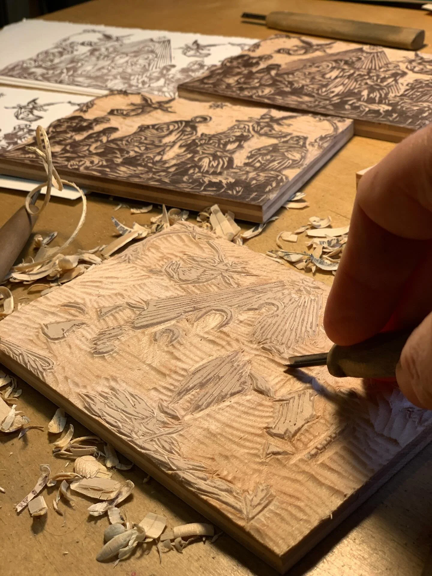 To make the sliding image woodcut Nativity card I first drew the image on a block, carved the image, printed the image, transferred the image to a second block, carved the second block, printed the second block, drew a second image (slightly differen